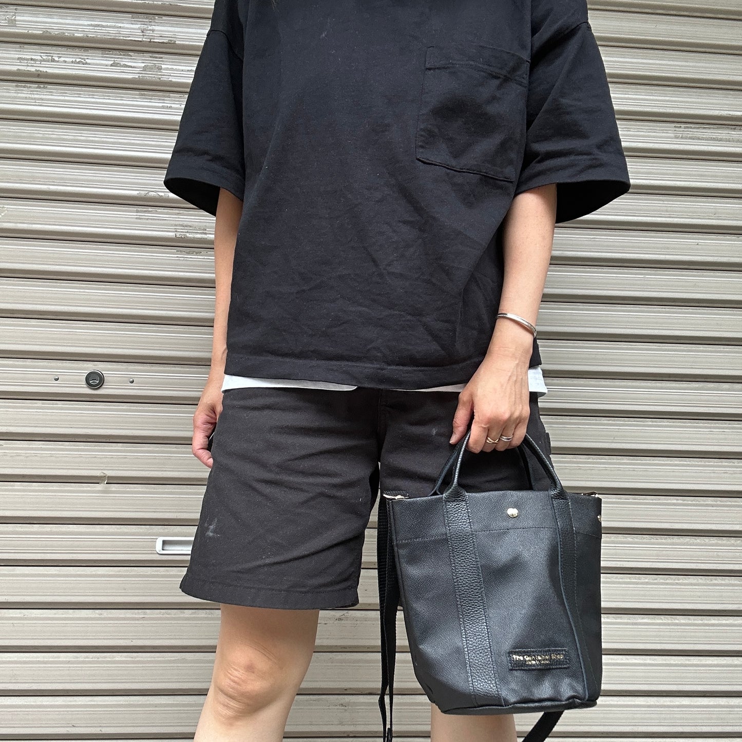 "Lightweight and wipeable" PVC processed (round bottom tote) in black camouflage