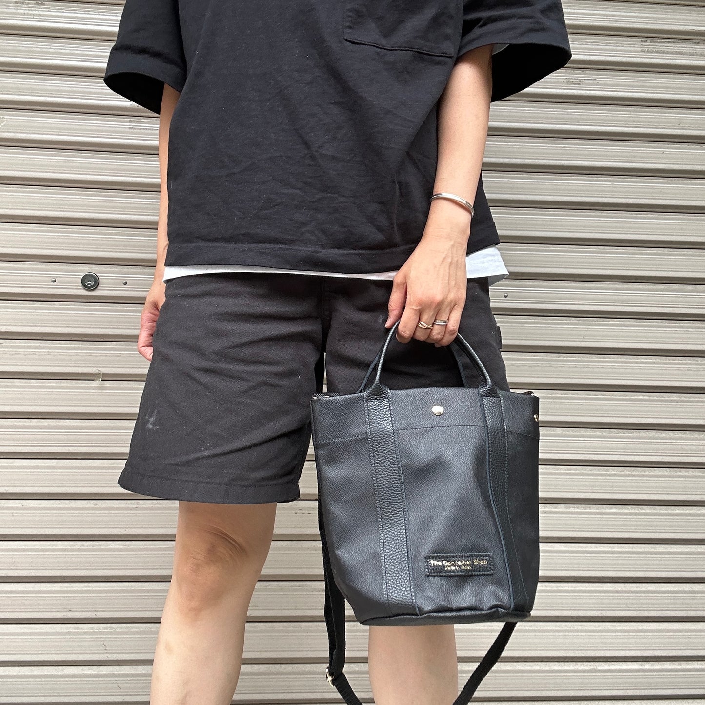 "Lightweight and wipeable" PVC processed (round bottom tote) in black camouflage