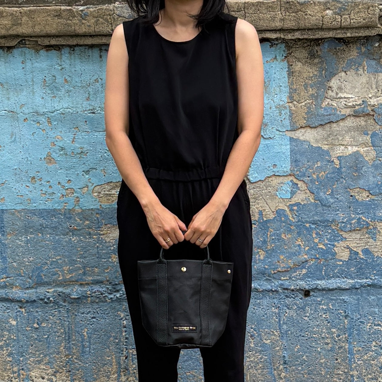 "Lightweight and wipeable" PVC processed (round bottom tote) in black camouflage