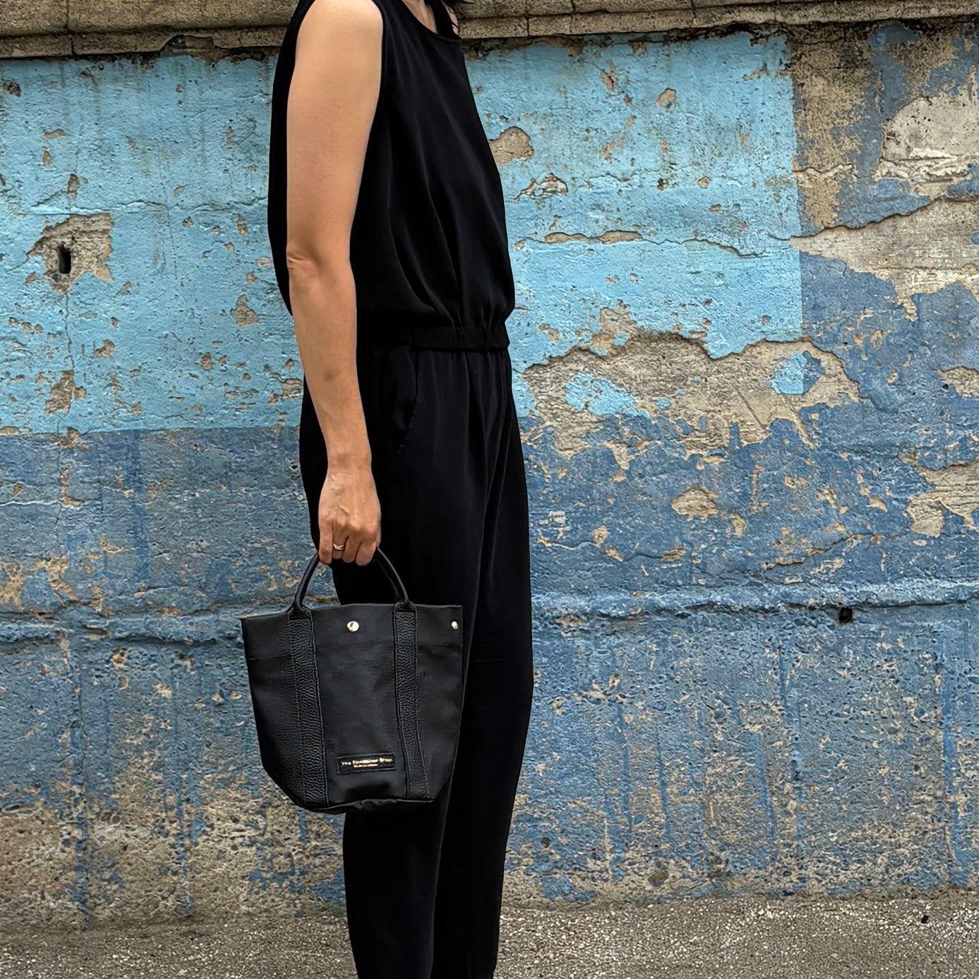 "Lightweight and wipeable" PVC processed (round bottom tote) in black camouflage