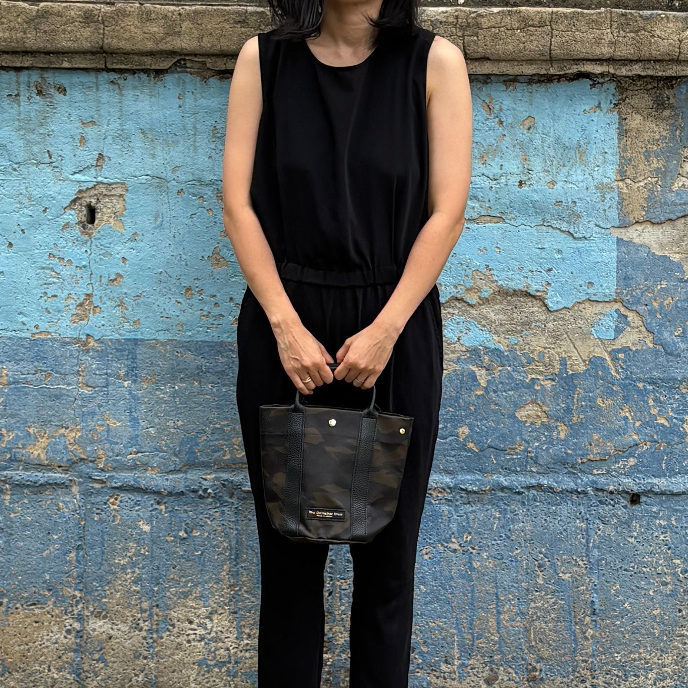 "Lightweight and wipeable" PVC processed (round bottom tote) in black camouflage