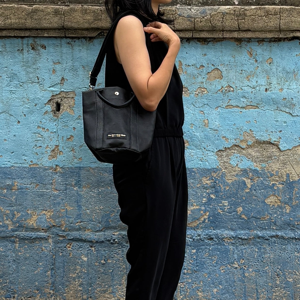 "Lightweight and wipeable" PVC processed (round bottom tote) in black camouflage