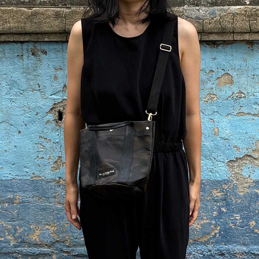 "Lightweight and wipeable" PVC processed (round bottom tote) in black camouflage