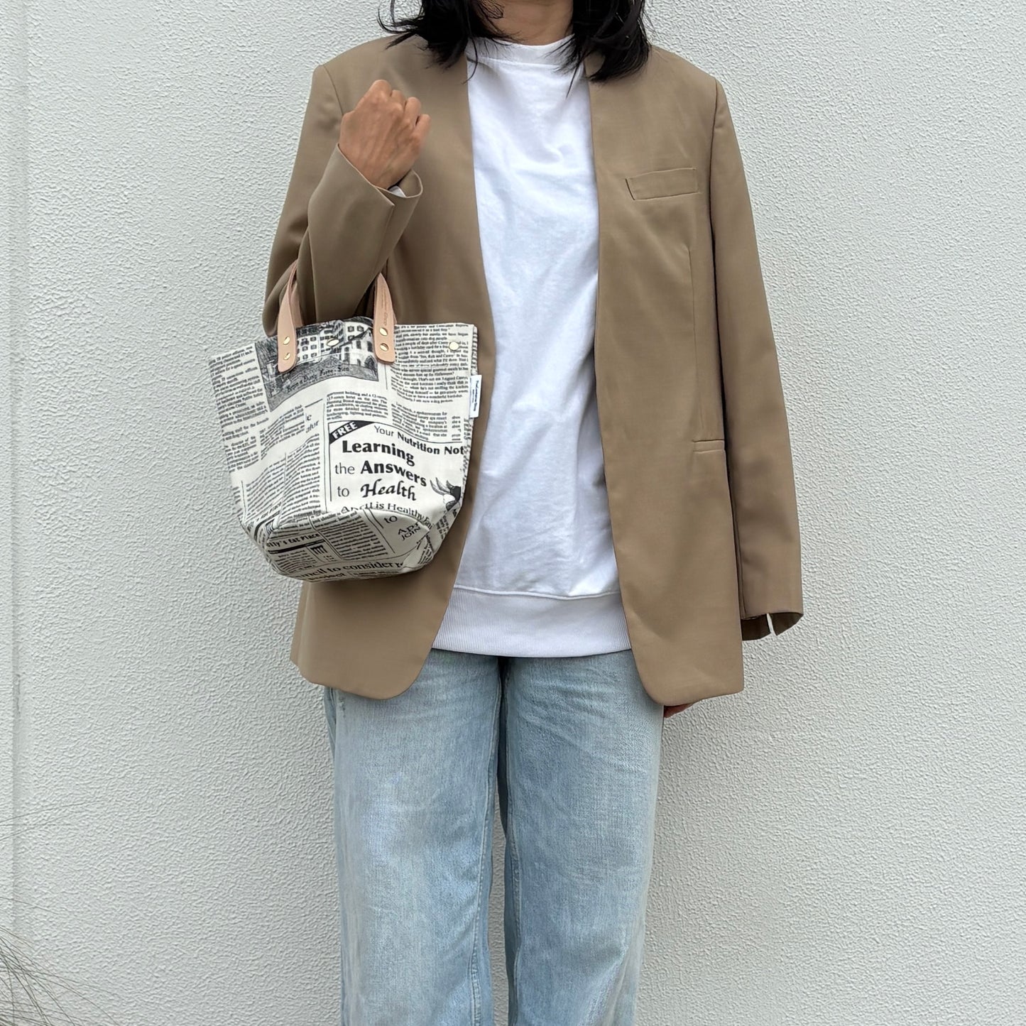 「軽くて拭ける」Coated PVC(丸底バッグ)Newspaper