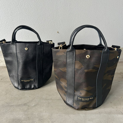 "Lightweight and wipeable" PVC processed (round bottom tote) in black camouflage