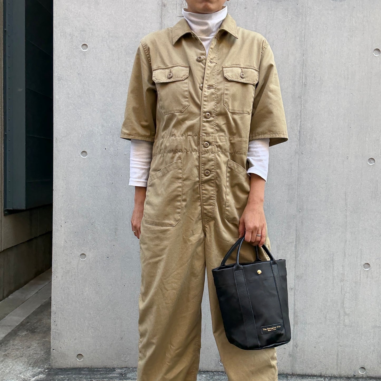 "Lightweight and wipeable" PVC processed (round bottom tote) in black camouflage