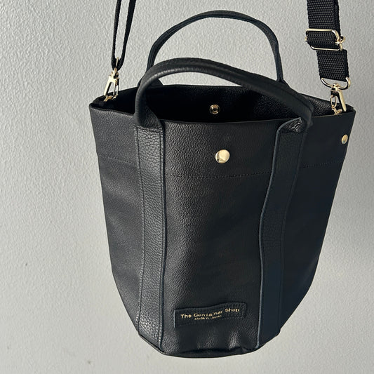 "Lightweight and wipeable" PVC processed (round bottom tote) in black camouflage