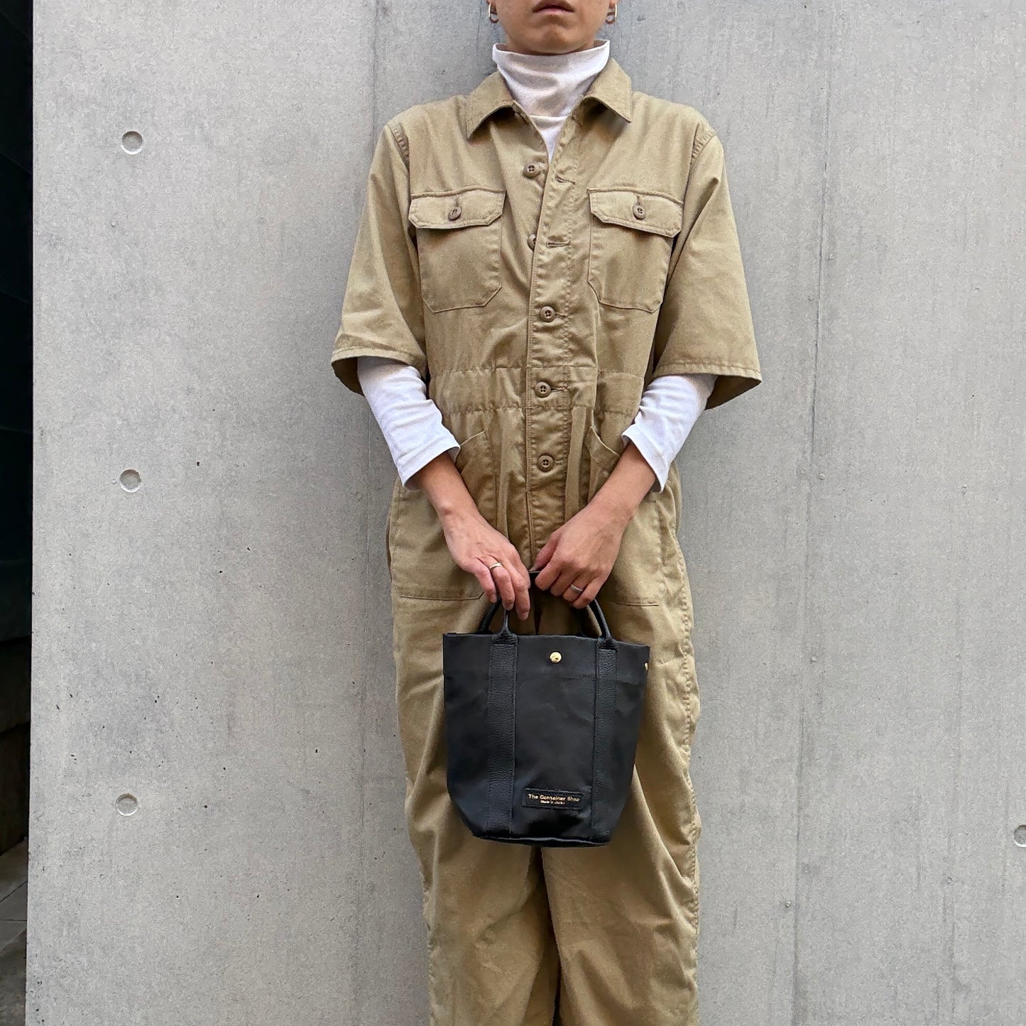 "Lightweight and wipeable" PVC processed (round bottom tote) in black camouflage