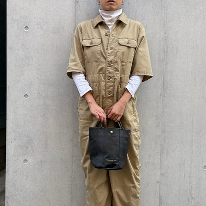 "Lightweight and wipeable" PVC processed (round bottom tote) in black camouflage