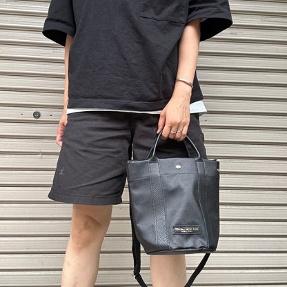 "Lightweight and wipeable" PVC processed (round bottom tote) in black camouflage