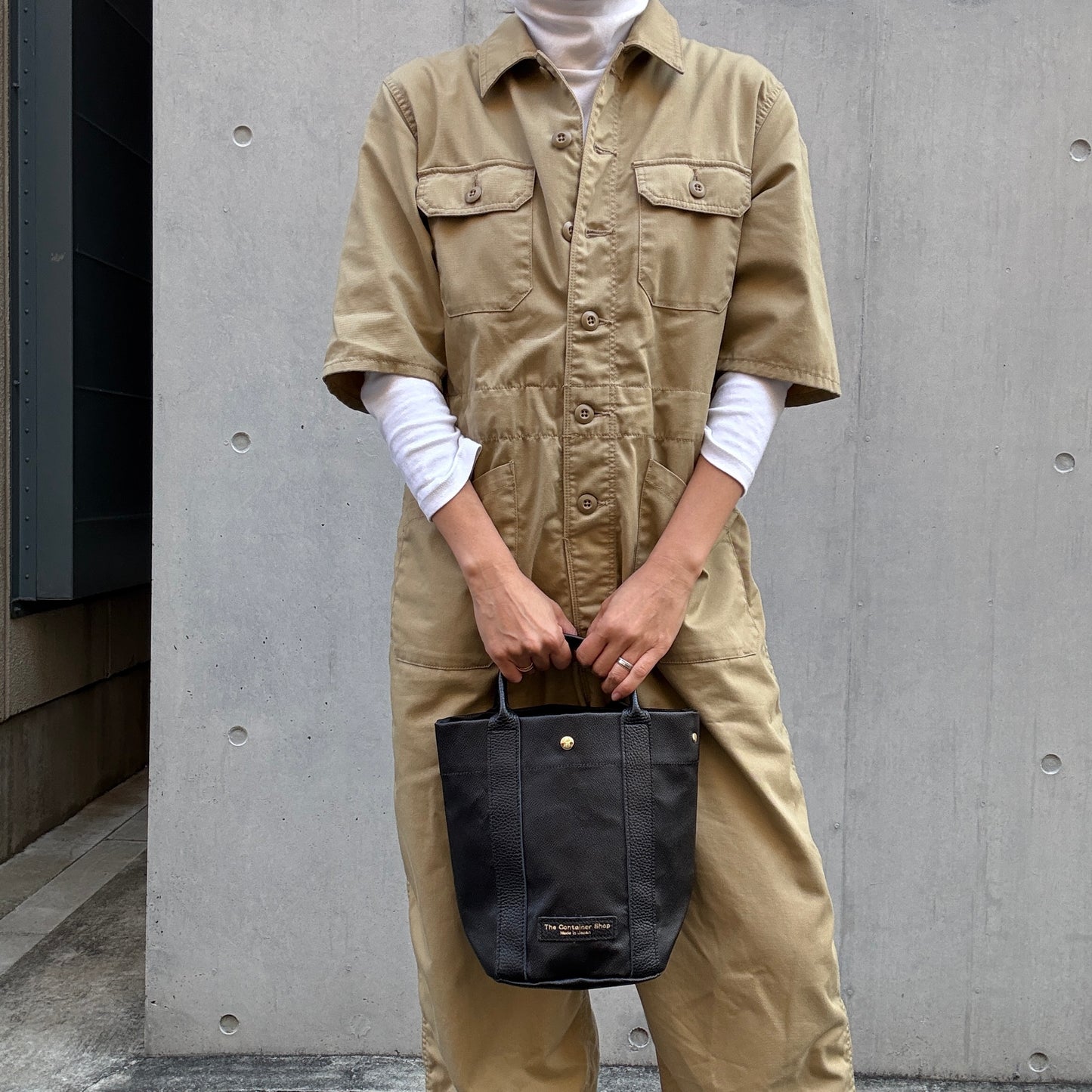 "Lightweight and wipeable" PVC processed (round bottom tote) in black camouflage