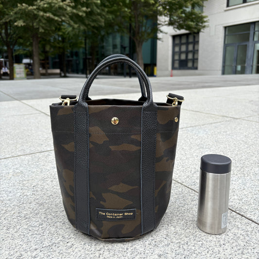"Lightweight and wipeable" PVC processed (round bottom tote) in black camouflage