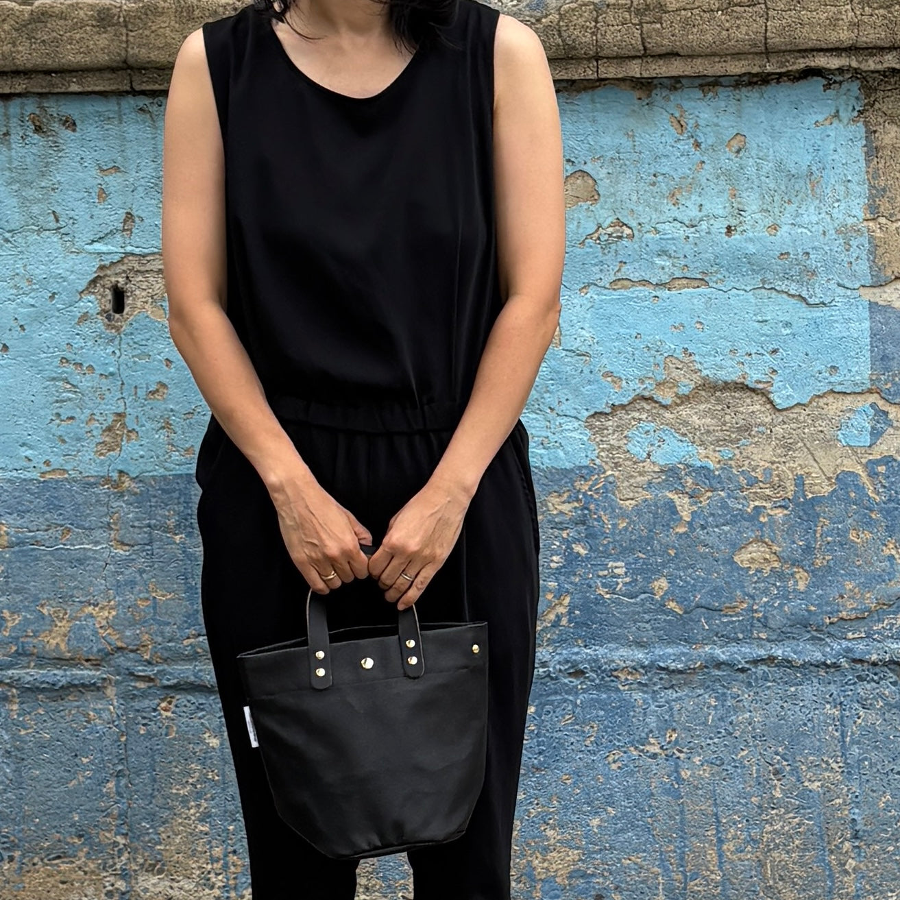  "Lightweight and wipeable" PVC-coated (round-bottom tote) in dark camouflage
