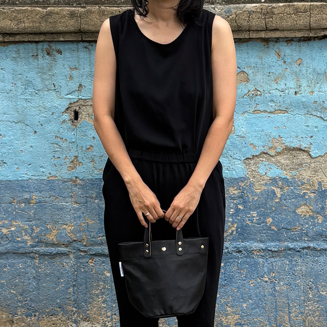  "Lightweight and wipeable" PVC-coated (round-bottom tote) in dark camouflage