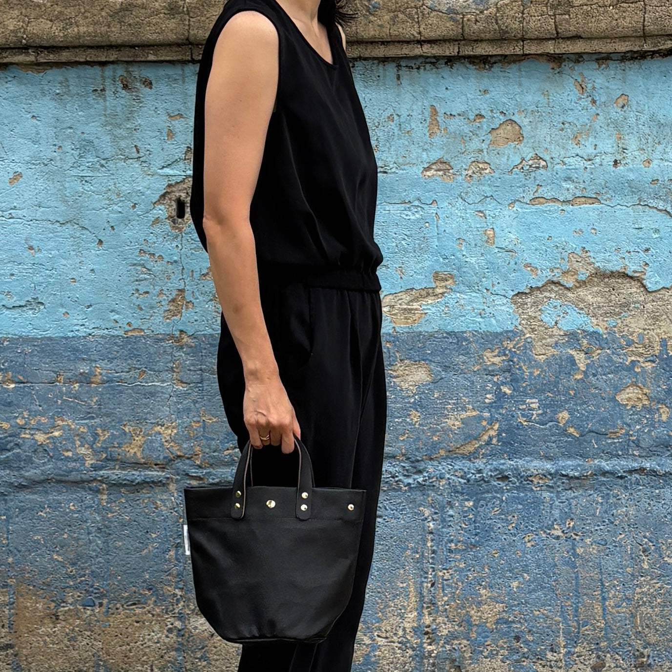  "Lightweight and wipeable" PVC-coated (round-bottom tote) in dark camouflage