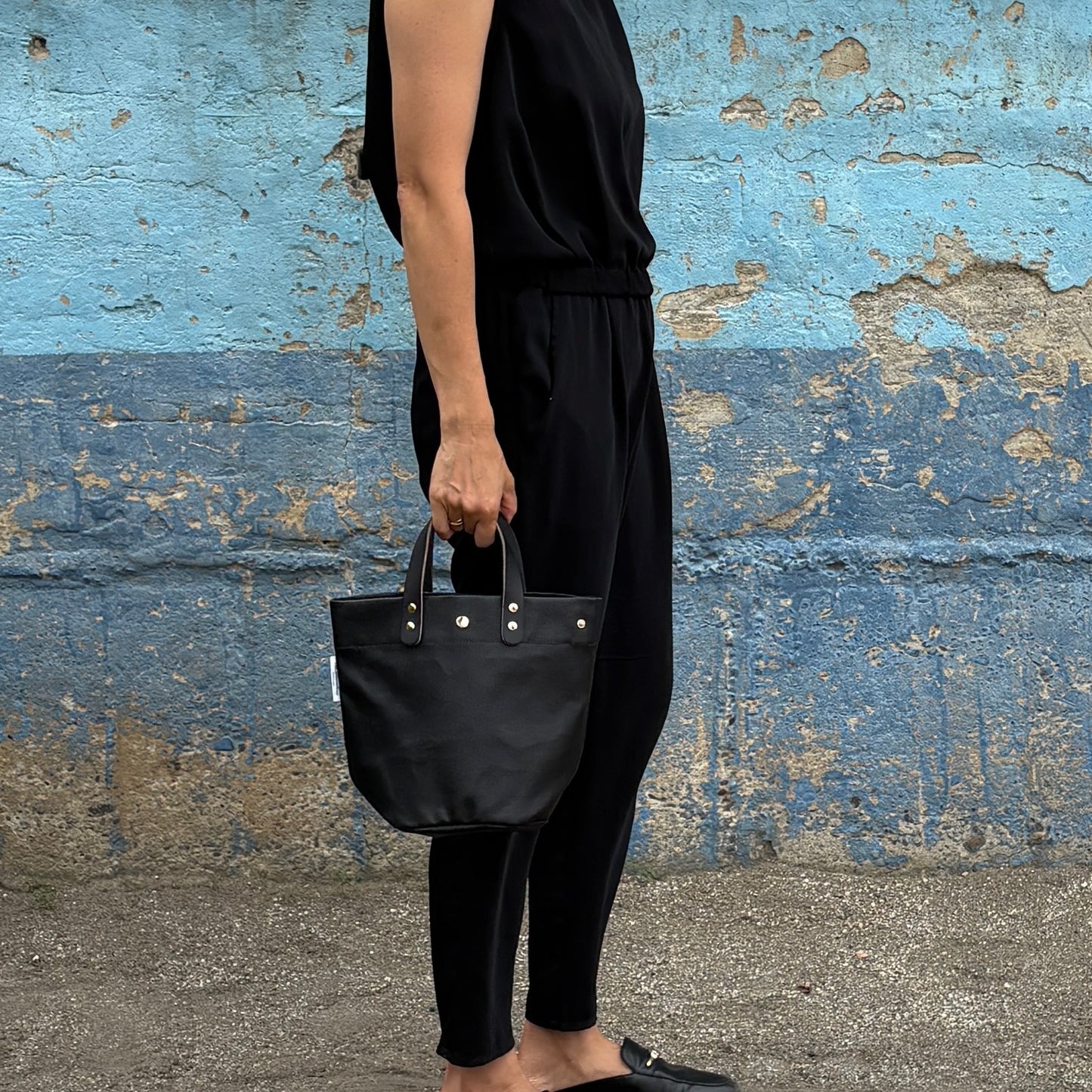  "Lightweight and wipeable" PVC-coated (round-bottom tote) in dark camouflage