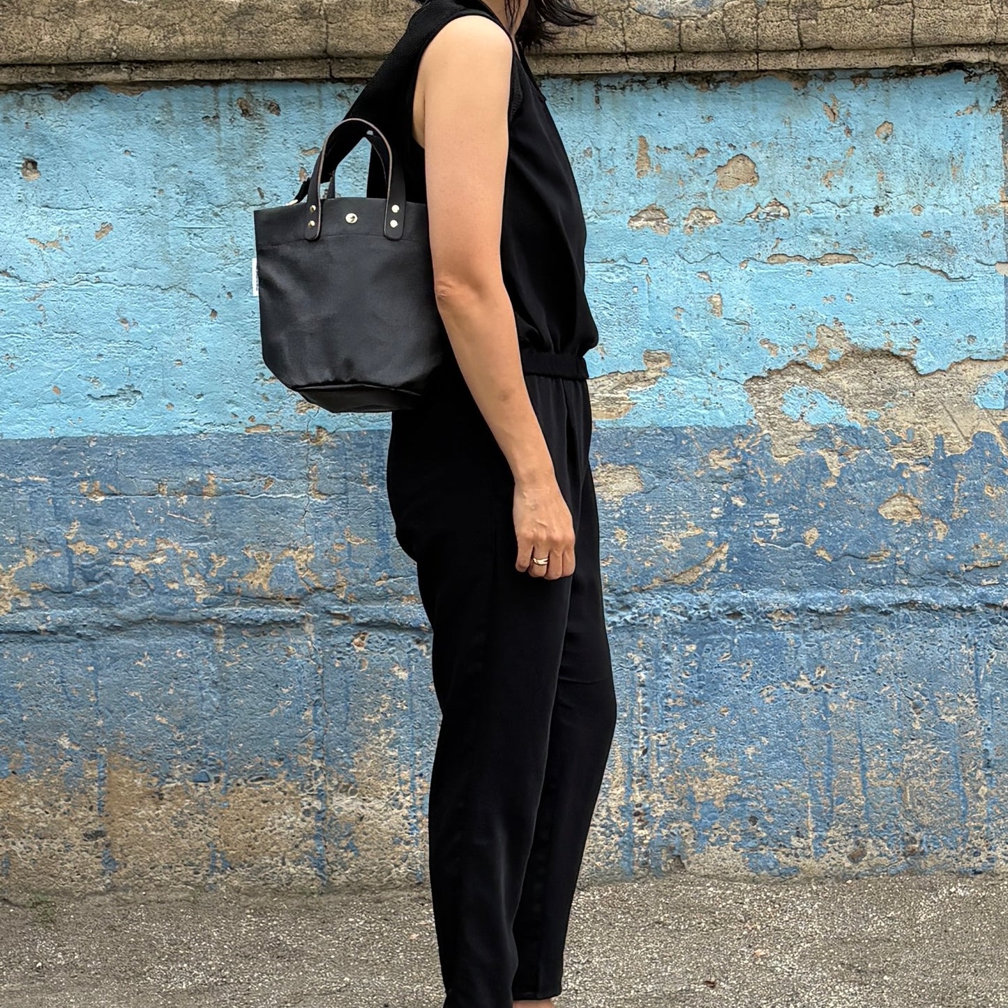  "Lightweight and wipeable" PVC-coated (round-bottom tote) in dark camouflage