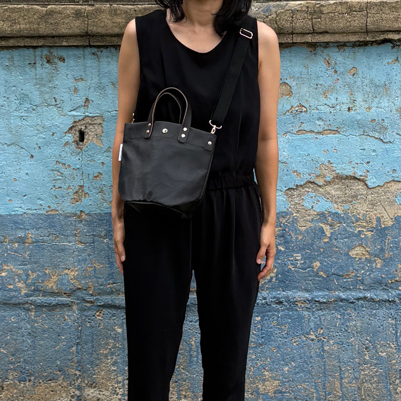  "Lightweight and wipeable" PVC-coated (round-bottom tote) in dark camouflage