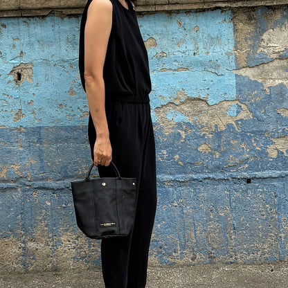 "Lightweight and wipeable" PVC processed (round bottom tote) in black camouflage