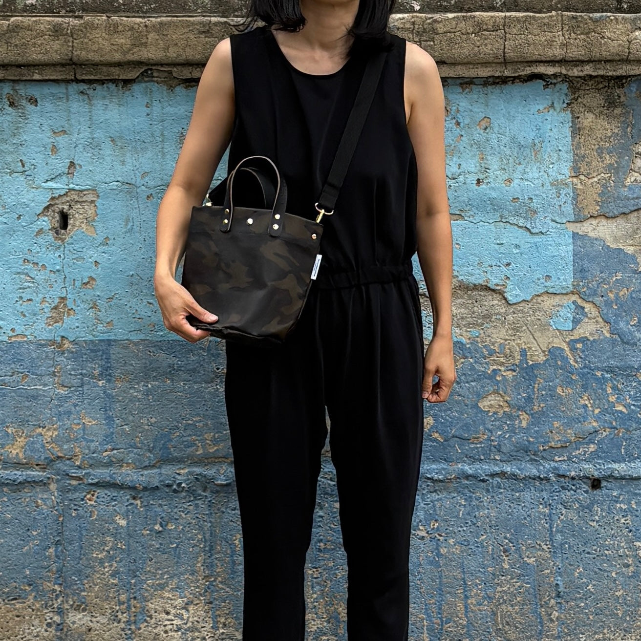  "Lightweight and wipeable" PVC-coated (round-bottom tote) in dark camouflage