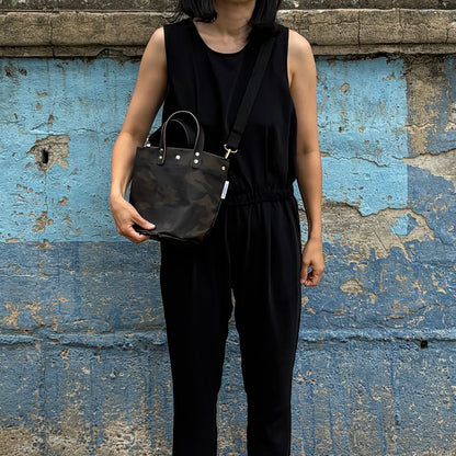  "Lightweight and wipeable" PVC-coated (round-bottom tote) in dark camouflage