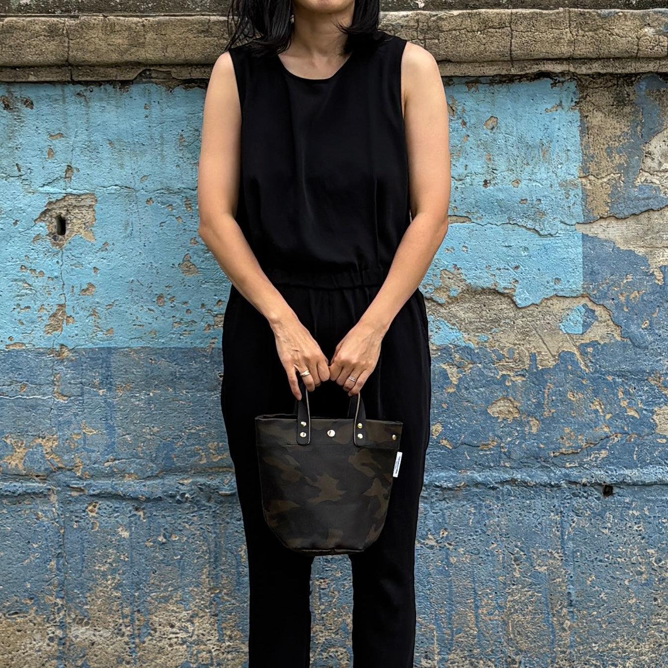  "Lightweight and wipeable" PVC-coated (round-bottom tote) in dark camouflage