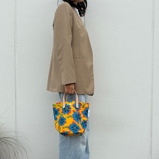 "Lightweight and wipeable" Coated PVC (round-bottom bag) Pansy