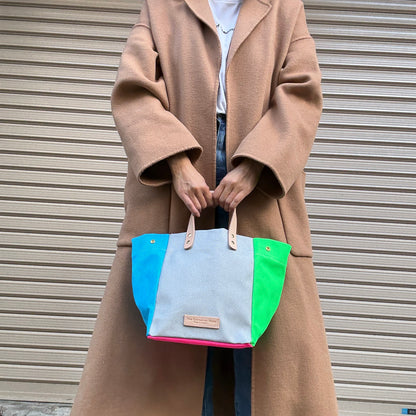 Comes with a multi-colored bag and a free pouch