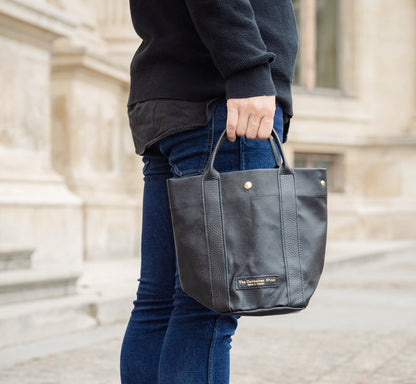 "Lightweight and wipeable" PVC processed (round bottom tote) in black camouflage