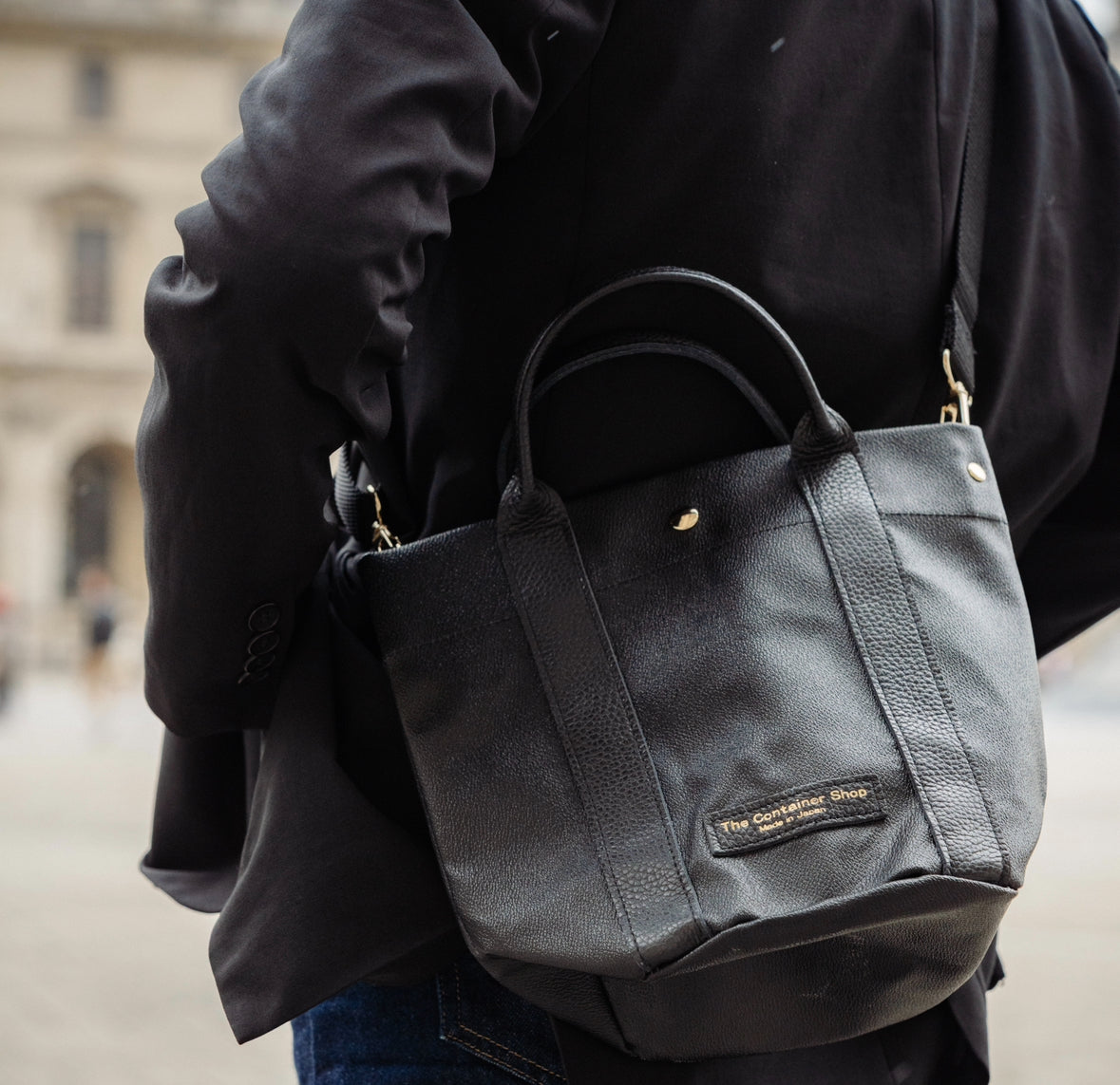 "Lightweight and wipeable" PVC processed (round bottom tote) in black camouflage